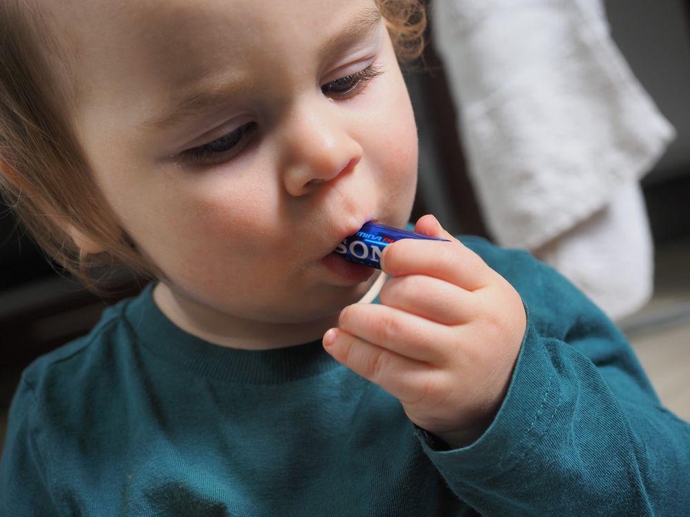 Belarus,,Minsk,2022.,Kid,Baby,Toddler,Holding,Her,Hand,Battery.,Dangerous