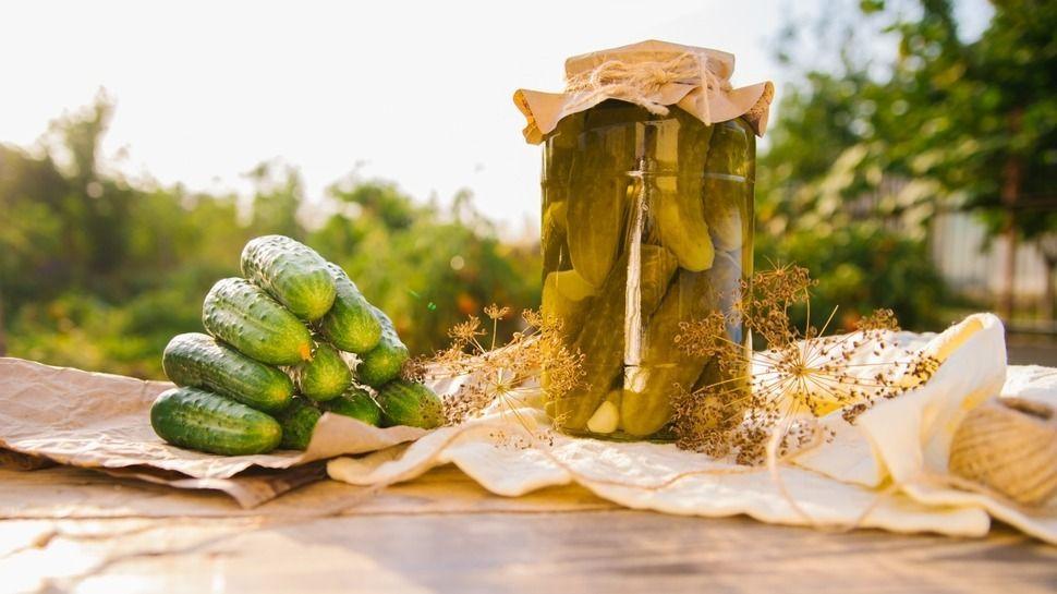 Salted,,Pickled,Cucumbers,In,A,Jar,On,A,Wooden,Table